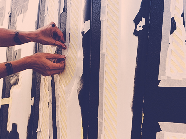 Pittura a mano su muro esterno